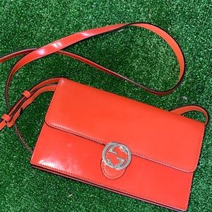 Authentic Gucci orange crossbody wallet.
